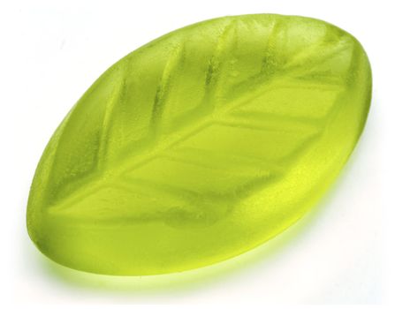Leaf shaped jelly in green color on white background.