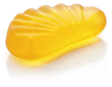 Mandarin shaped jelly in orange color on white background.