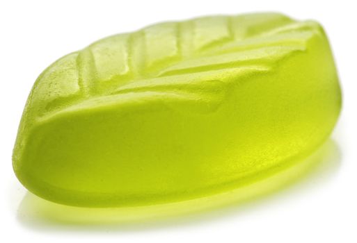 Leaf shaped jelly in green color on white background. Soft focus.