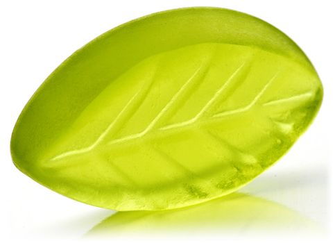 Leaf shaped jelly in green color on white background.