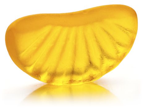 Mandarin shaped jelly in orange color on white background.