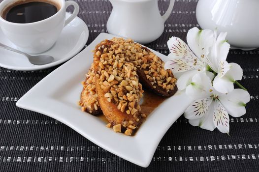 French toast with walnuts and cinnamon and a cup of coffee