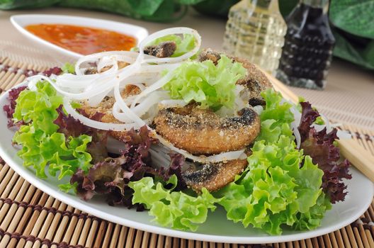 Salad of rice noodles in lettuce leaves with mushrooms in breadcrumbs