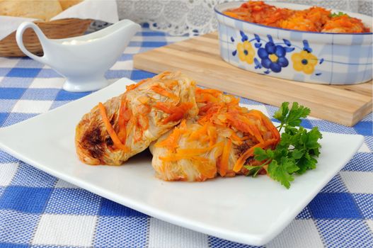 Stuffed cabbage stewed in tomato gravy with onions and carrots