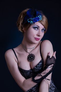 Retro-styled woman in cabaret outfit over dark back