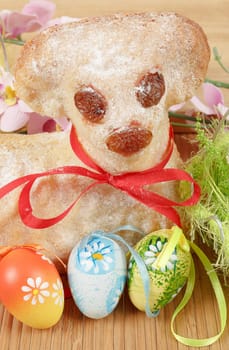 Easter lamb with painted eggs and easter decorations