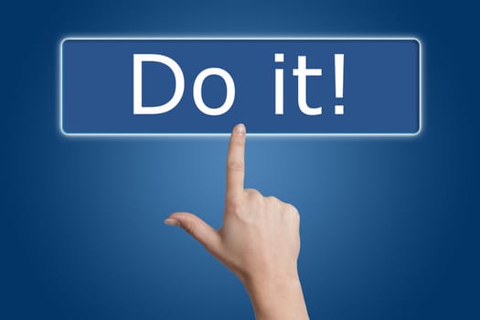 Woman hand pressing a button with word " do it! " on blue background