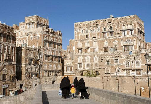 veiled women in sanaa old town in yemen