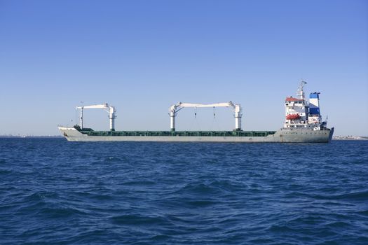 Big gray supertanker petrol oil boat transportation on a bule day