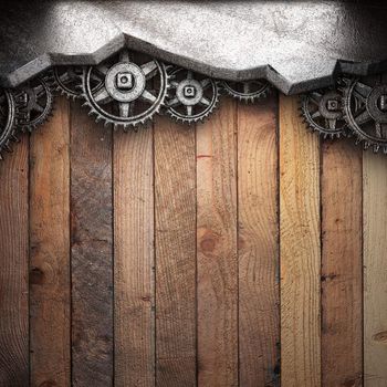 gear wheels on wooden background