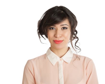 Portrait of a beautiful brunette in a pink blouse.