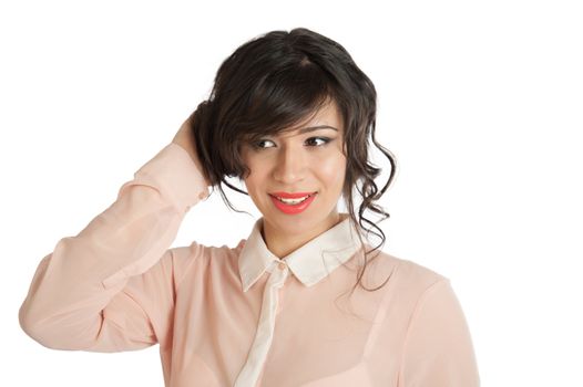 A woman in a pink blouse holds hands hair.