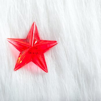 christmas red star over winter white fur background