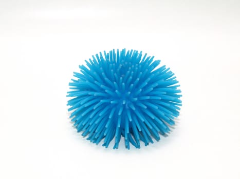 A blue rubber squishy ball isolated on a white background.