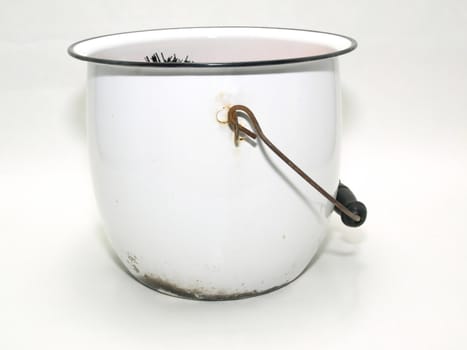 An old white metal bucket isolated against a white background.