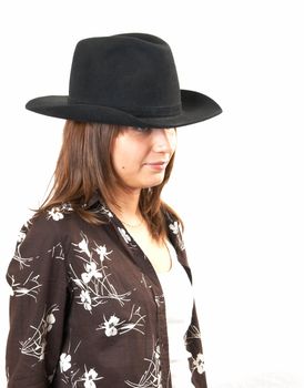 The girl in a brown jacket and a cowboy's hat