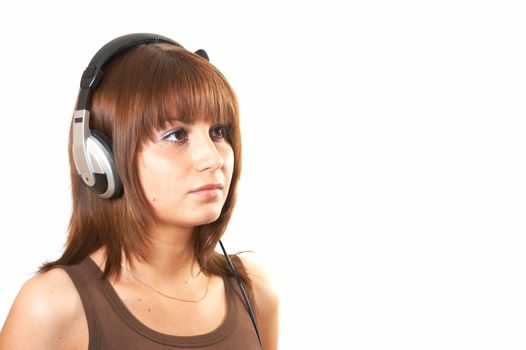 The girl in brown with headphones on a white background 