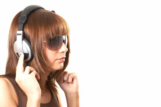 The girl in brown with headphones on a white background 