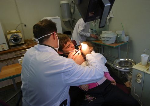 Patient and doctor in stomatological office
