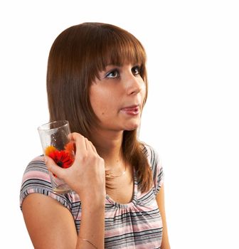 The girl drinking juice on a white background 