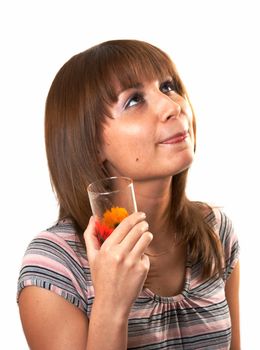 The girl drinking juice on a white background 