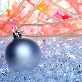 christmas baubles silver on winter ice with star symbol and ribbon