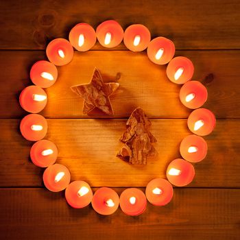 christmas candles circle over wood and tree star symbol