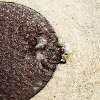 manhole over flowing water in a rainy day with sewerage problem