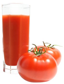 Glass of tomato juice and two tomatoes.