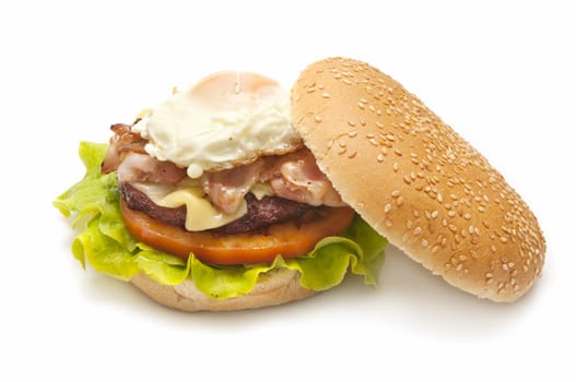 special burger with cheese, tomato, lettuce, meat, eggs, bacon and mustard sauce and tomato
