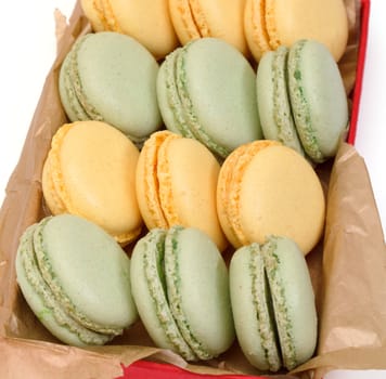 Colorful Macaron in paper box on white background