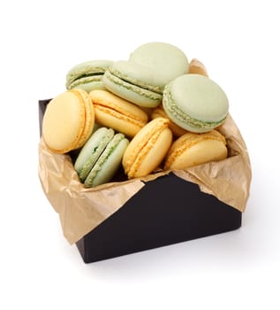 Colorful Macaron in paper box on white background