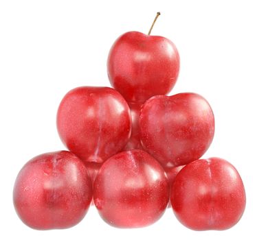 Ripe plums on a white background.