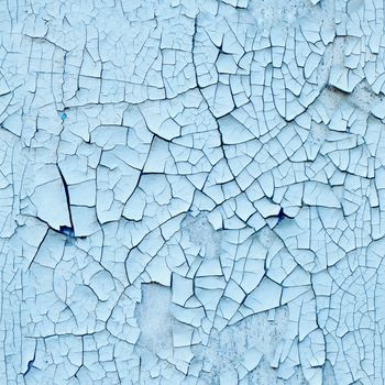 Wall covered with old enamel with a cracks - seamless texture