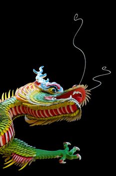 Decorative Chinese dragon in the temple, and repair of a black background