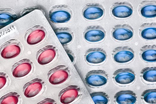 Red and Blue Pills On Metal Blister, copy space