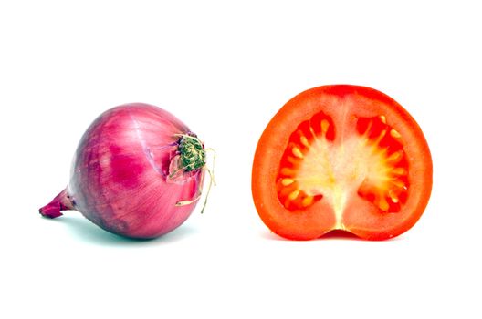 Red onion and half cut tomato isolated on white background. Healthy diet of organic vegetables.