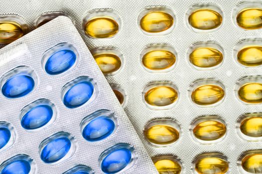 Yellow And Blue Pills in blister, copy space