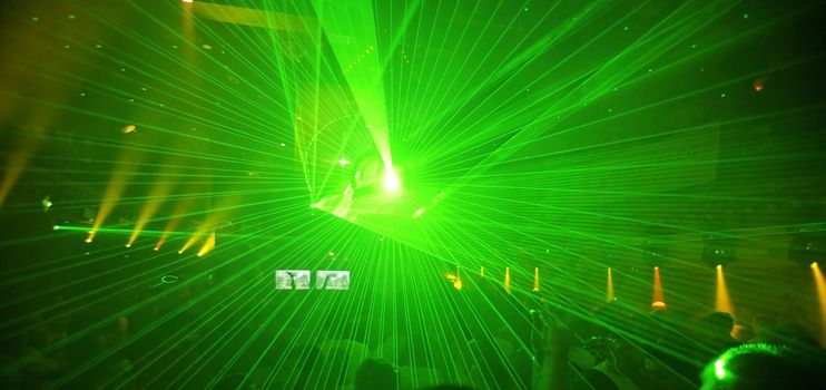 Colored laser party in entertainment disco club