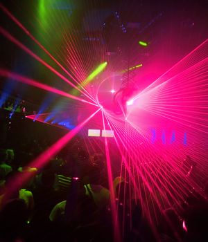 Lolored laser party in entertainment disco club