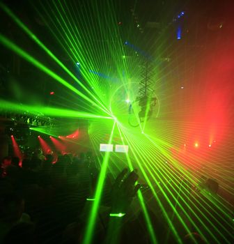 Lolored laser party in entertainment disco club