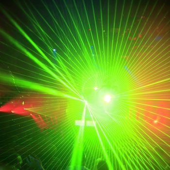 Colored laser party in entertainment disco club