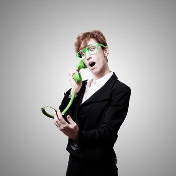 business woman with phone on gray background