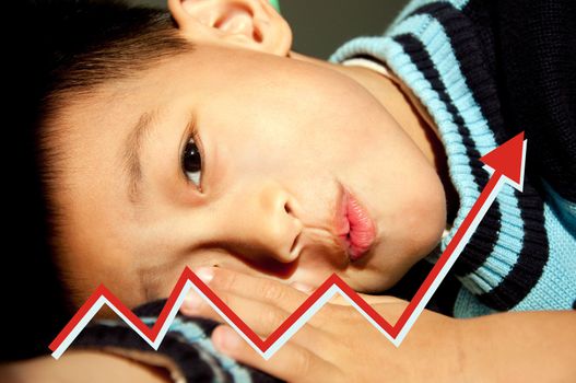 A boy lying on the side watching the performance curve