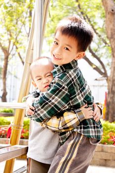 The brothers embraced each other in the park