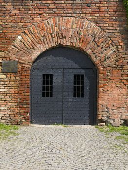 Old Metal Gate on Brick Wall