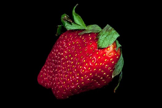 fresh red strawberry isolated on a black background