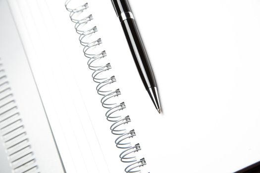 white paper, pencil, Address book with metal spiral