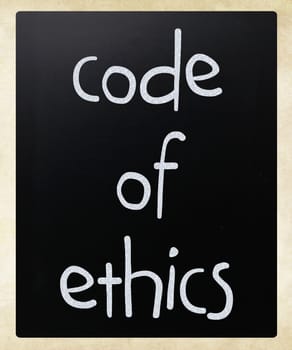 "Code of ethics" handwritten with white chalk on a blackboard