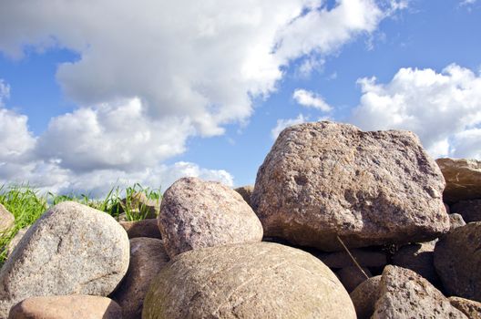 rural landscape with stones and sky clouds
